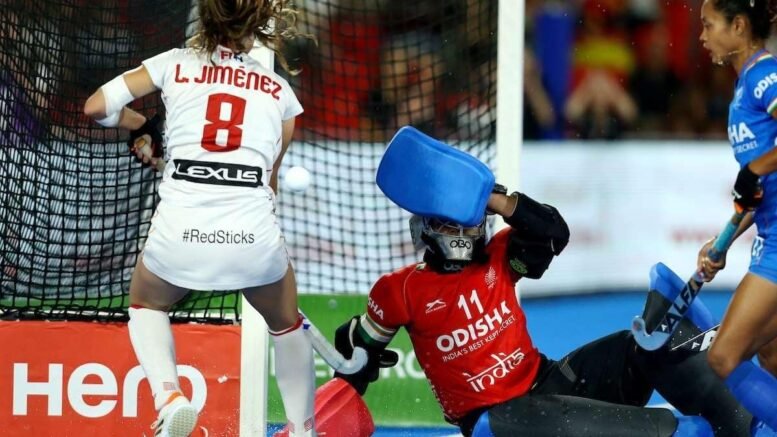 RJ22207103686 - World Cup: India Lose Tight Affair to Co-hosts Spain - The Indian women’s hockey team crashed out of the FIH World Cup title race after losing 0-1 to co-hosts Spain in a hard-fought crossover match here on Monday. After a fiercely-contested three quarters, the Indian defence let in a goal just three minutes from the final hooter when Marta Segu scored from a rebound to exit from the knock-out rounds. As has been the case so far in the tournament, India fared poorly once again in converting penalty corners. They earned four in the game against Spain’s three but all the chances went in vain.
