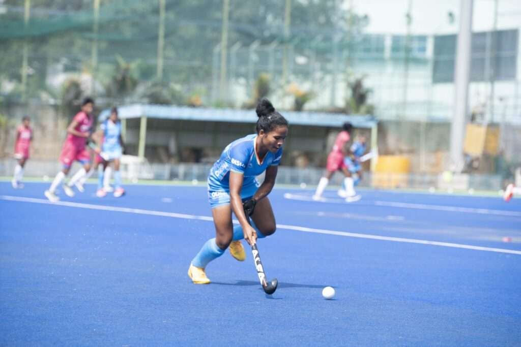 asia learning experience to train alongside senior players says indian womens hockey team defender ropni kumari 662be76812309 - Asia: ‘Learning experience to train alongside senior players,’ says Indian Women’s Hockey Team defender Ropni Kumari - Ropni was recently named among the 33-member National Women’s TeamCore group that is training at the SAI Centre in Bengaluru ~_New Delhi, 24th April 2024: Ropni Kumari, Indian Women’s Hockey Teamdefender, looked back on the previous year and explained how consistentopportunities to play with the Indian Junior Women’s Hockey Team havecontributed to her development. The 19-year-old was part of the teamthat claimed the Gold medal at the Women’s Junior Asia Cup 2023 and alsotravelled with the team to Dusseldorf, Germany for the 2023 4 NationsJunior Women’s Invitational Tournament. Ropni was also a key player forthe side at the 2023 FIH Junior World Cup in Santiago, Chile and playedin all six games.“It was a good year for me as I was able to earn consistentopportunities with the team and was able to improve as a player. I amthankful to the support staff and the coaches for backing me and also tomy teammates for allowing me to express myself. Winning the Gold medalat the Women’s Junior Asia Cup remains one of my favourite memories,”she said.Ropni was recently named among the 33-member National Women’s Team Coregroup that is training at the SAI Centre in Bengaluru which will runtill 16th May. She was among the players that were selected from the60-member assessment squad that reported to camp on 1st April, after theselection trials that were held on 6th and 7th April.Speaking on her experiences of training with the Senior Team, Ropnisaid, “It has been a fantastic experience for me as I can rub shoulderswith the best players. They are constantly giving us proper guidance andensuring we feel comfortable at all times.”On being asked about what advice she has received from the seniorplayers, Ropni elaborated, “They are constantly advising us on how todeal with pressure and how to remain calm during tough games. It hasbeen one of the key aspects where I feel I can improve. It has beenquite a learning experience for me, and I feel it will help inincreasing the rate of my growth.Ropni, now, is looking to work even harder to make her debut for theSenior Team and is hoping she gets a chance to showcase her talentagainst the top competitors. “It is everyone’s dream to represent thecountry, and as a team, we are quite focused this year on our growth. Iam looking forward to working even harder so that I am ready whenever myname is called up to be a part of the senior team squad. I hope tocompete against the best teams as it will also help me in understandingthe level of hockey that is played at this level,” she signed off.