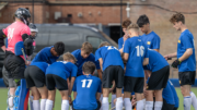 Talent Academy players, boys, Huddling, wearing blue